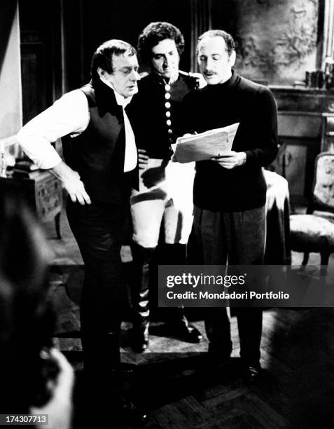 Movie director Vittorio Cottafavi shows the script to actors Renzo Palmer and Walter Maestosi, interpreting respectively Napoleon and the french...