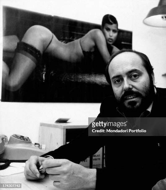 The Italian stylist Elio Fiorucci poses in his study. Italy, 1974..