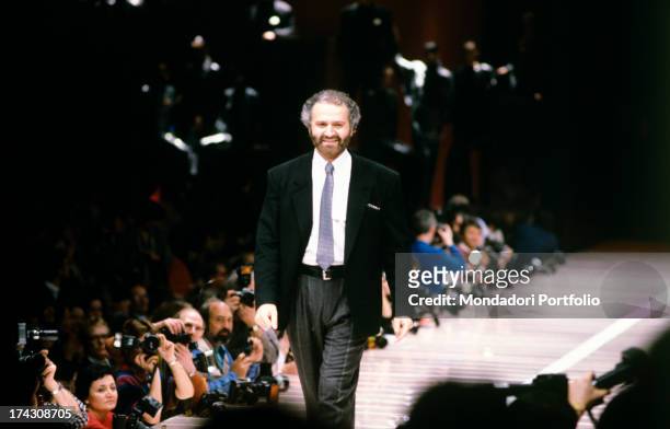 Italian fashion designer Gianni Versace parading on the catwalk after his fashion show. 1980s.