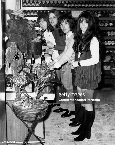 The four members of the Shocking Blue at the buffet of a restaurant, near the wine racks; the Dutch rock band reached number one in U.S. Chart with...