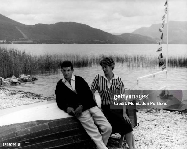 The actors Jean-Claude Brialy and Alida Valli, playing the leading roles of Jacky and Agathe, a couple in crisis, are photographed in a lake shore,...