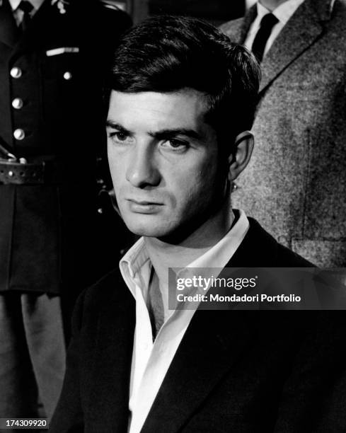 The French actor Jean-Claude Brialy, playing the leading role of Jacky in Deray's The gigolo, photographed near a man in uniform after the put in...