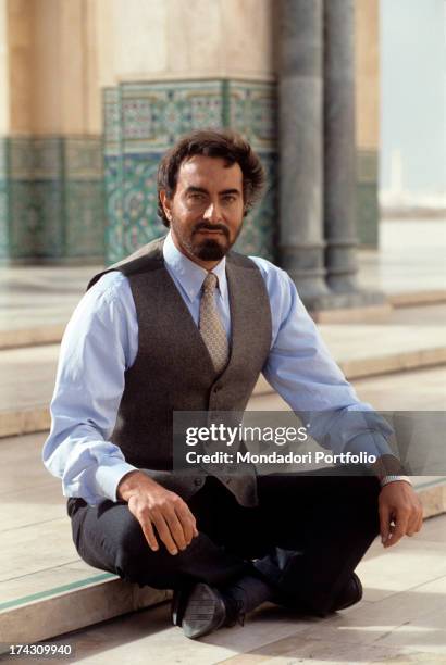 The Indian actor Kabir Bedi looks at the camera, seated in the atrium of the newly built Mosque of Hassan II; he's in Morocco for the making of Ma...