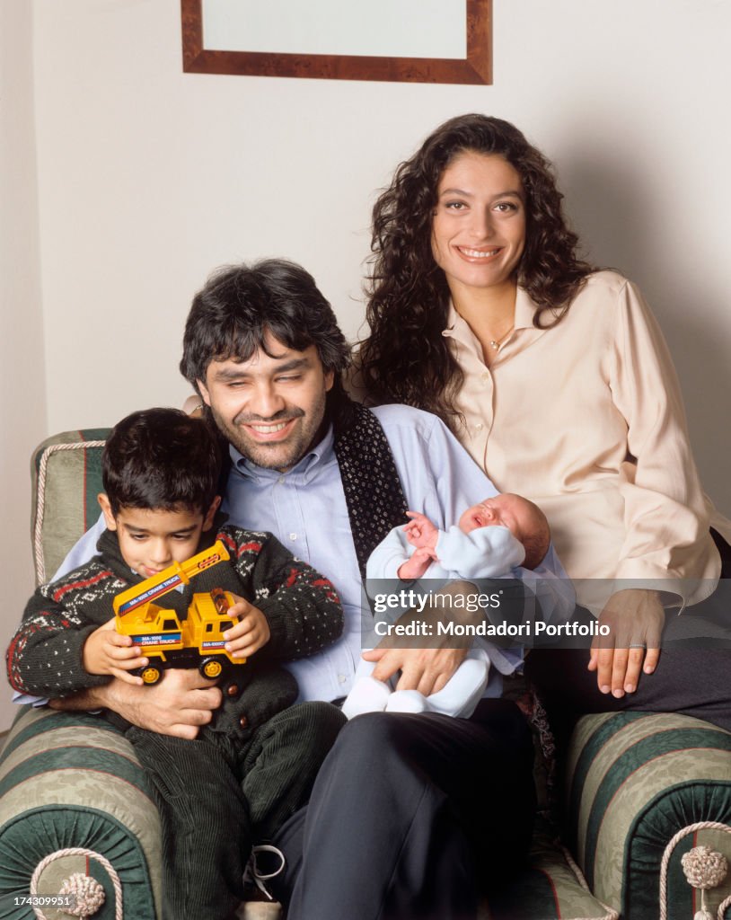 Andrea Bocelli In An Armchair With His Wife Enrica Cenzatti And Their Childre Amos And Matteo