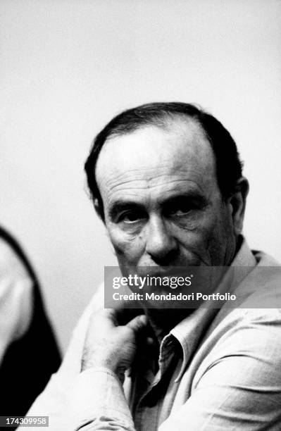 The Italian journalist and writer Giorgio Bocca, co-founder of the daily Repubblica, looking to the camera with a hand on his neck. Italy, the '70s..