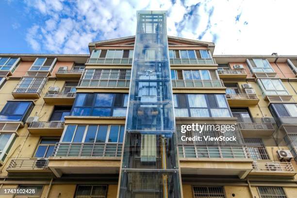 henan huaxian county enjoys old buildings equipped with elevators - huaxian stock pictures, royalty-free photos & images