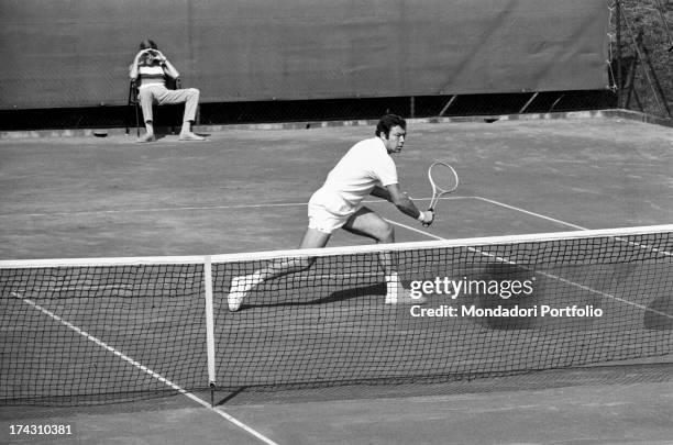 Italian tennis player Nicola Pietrangeli playing and winning the Italian tennis championship's final against Italian tennis player Ezio Di Matteo....