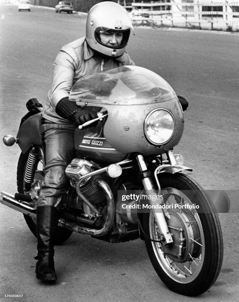 Claudio Villa Riding A Motorcycle