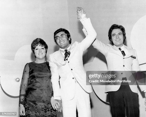 Italian singers Al Bano , Mario Tessuto and Orietta Berti posing smiling. They came first, second and third at the sixth edition of Italian song...