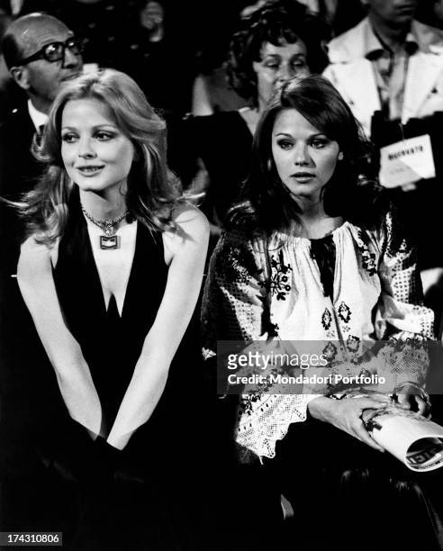 Swedish actress Ewa Aulin sitting beside Italian actress Agostina Belli . Taormina, 1972.