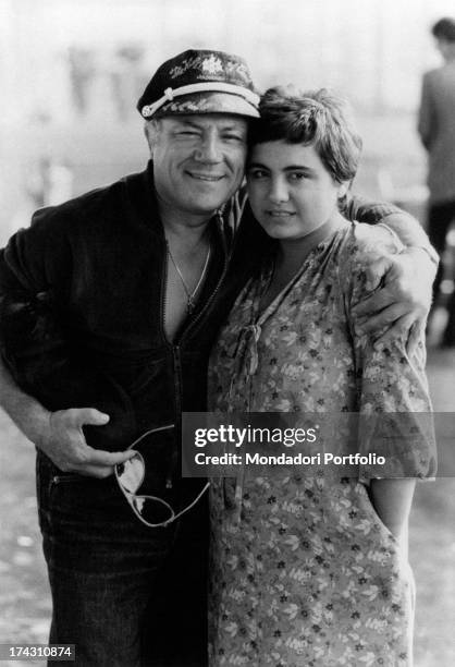 Italian singer and actor Claudio Villa hugging his wife Patrizia Baldi. Rome, 1979.