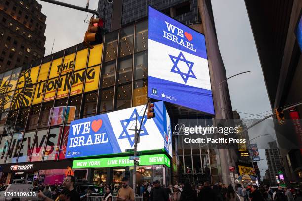 Billboards displayed photos of kidnapped and Israeli flags as thousands of people gathered for rally organized by IAC on Times Square demanding...