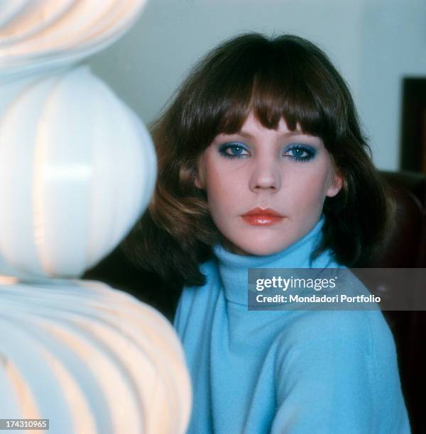 Italian actress Andreina Pagnani looking at Italian actor Carlo Hintermann asleep in the theatrical drama Quaderno proibito. Rome, December 1961.