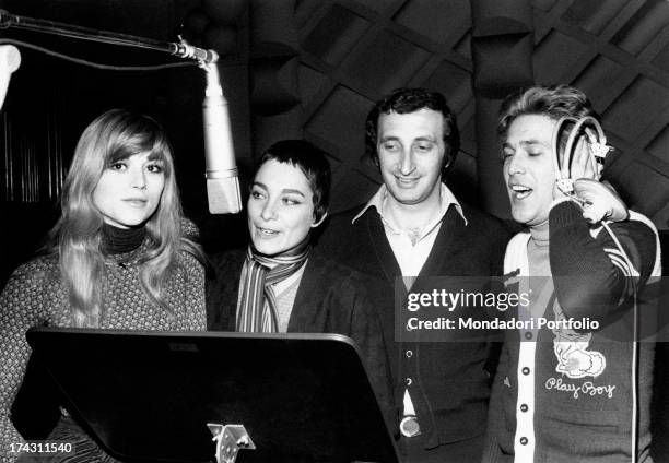 Italian singers Marina Occhiena, Angela Brambati, Angelo Sotgiu and Franco Gatti trying a song in a recording studio. They form the band Ricchi e...