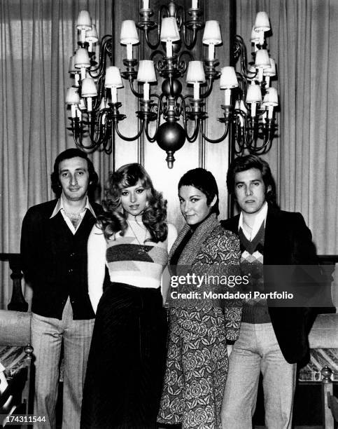 Italian singers Marina Occhiena, Angela Brambati, Angelo Sotgiu and Franco Gatti posing together. They form the band Ricchi e Poveri. Rome, 1970s.