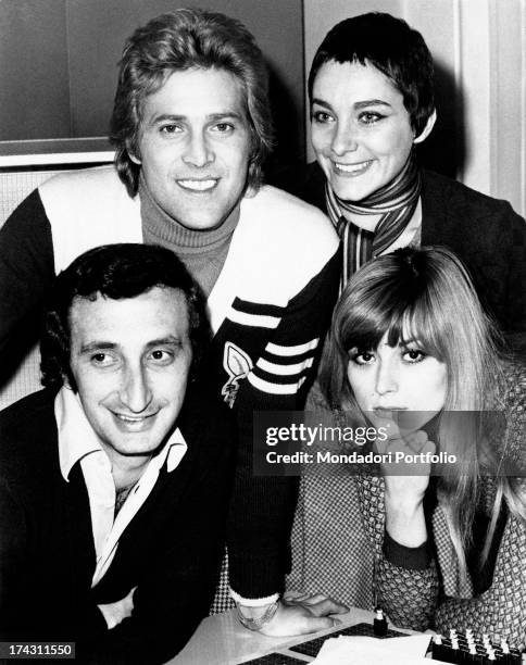 Italian singers Marina Occhiena, Angela Brambati, Angelo Sotgiu and Franco Gatti posing smiling. They form the band Ricchi e Poveri. Milan, 1970s.
