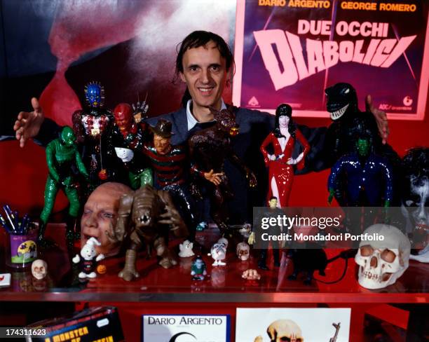 Italian director and scriptwriter Dario Argento posing inside his shop Profondo Rosso among items and statuettes depicting horror characters. Rome,...