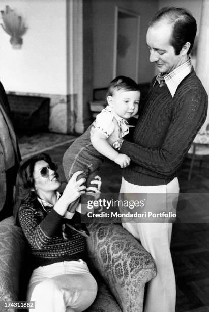 Italian singer and record producer Caterina Caselli and her husband, Italian record producer Piero Sugar, holding their son Filippo Sugar in their...
