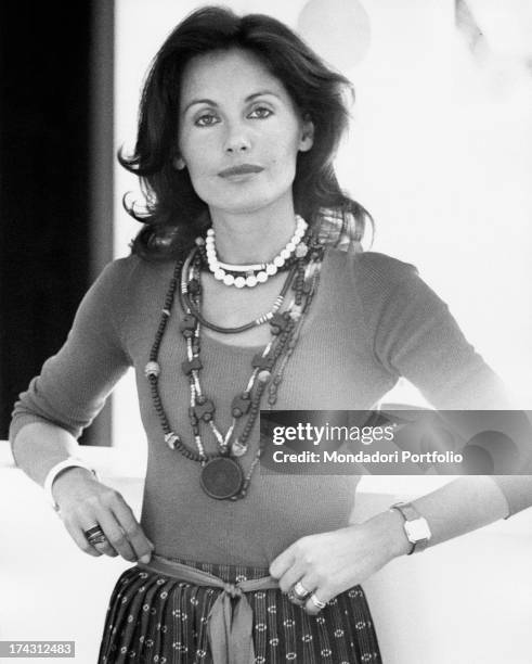 Italian television presenter and actress Gabriella Farinon holding her hand on her hips. Rome, 1970s.