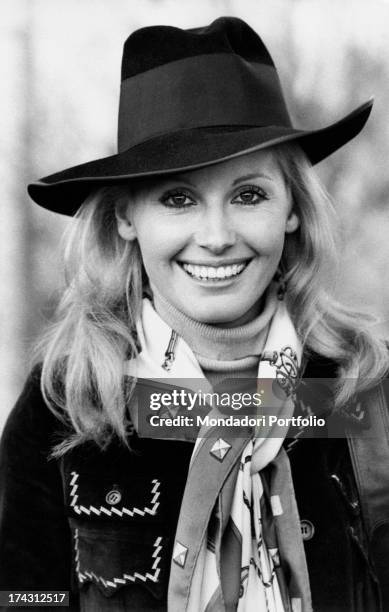 Italian television presenter and actress Gabriella Farinon smiling wearing a hat. Rome, 1970s.