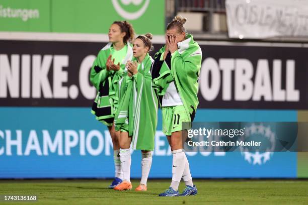 Fenna Kalma, Svenja Huth and Alexandra Popp of VfL Wolfsburg leave the pitch dejected after the UEFA Women's Champions League Qualifying Round 2...