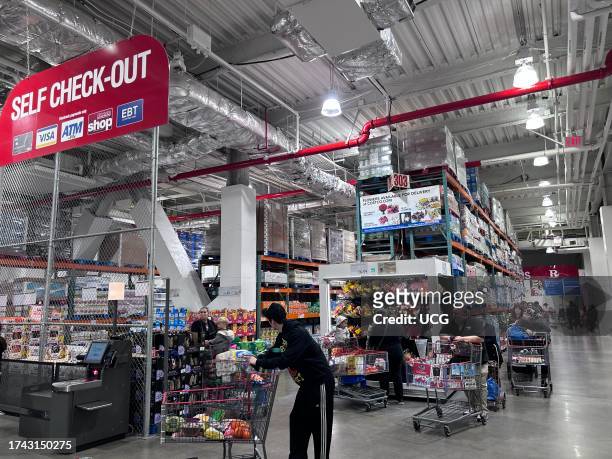 Customers using Costco Self-service check out area, Queens, New York.