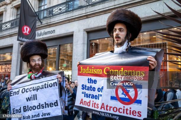 London, UK, Men from the anti-Zionist Haredi Jewish group Neturei Karta, or Guardians of the City, protests in London support of Palestine and...