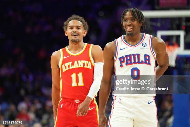 Trae Young of the Atlanta Hawks and Tyrese Maxey of the Philadelphia 76ers look on during the game on October 20, 2023 at the Wells Fargo Center in...