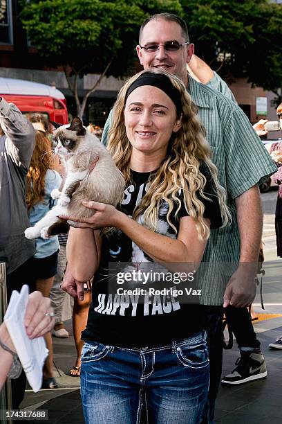 Cat Tardar Sauce, owner Tabatha Bundesen and brother Bryan Bundesen arrive as Grumpy Cat makes appearance at Kitson Santa Monica on July 23, 2013 in...