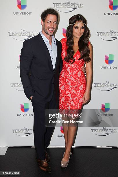 Actor William Levy and actress Ximena Navarrete attend the premiere of Univision's new telenovela "La Tempestad" at Universal CityWalk on July 23,...