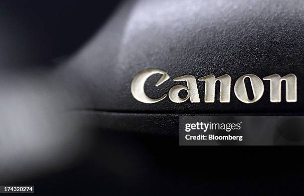 The Canon Inc. Logo is seen on an EOS 1DX digital camera in this arranged photograph in Tokyo, Japan, on Tuesday, July 23, 2013. Canon Inc., the...