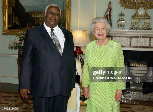 Queen Elizabeth II receives the Governor General of Saint Christopher and Nevis, Sir Cuthbert Sebastian, at Buckingham Palace in London 07 July 7...