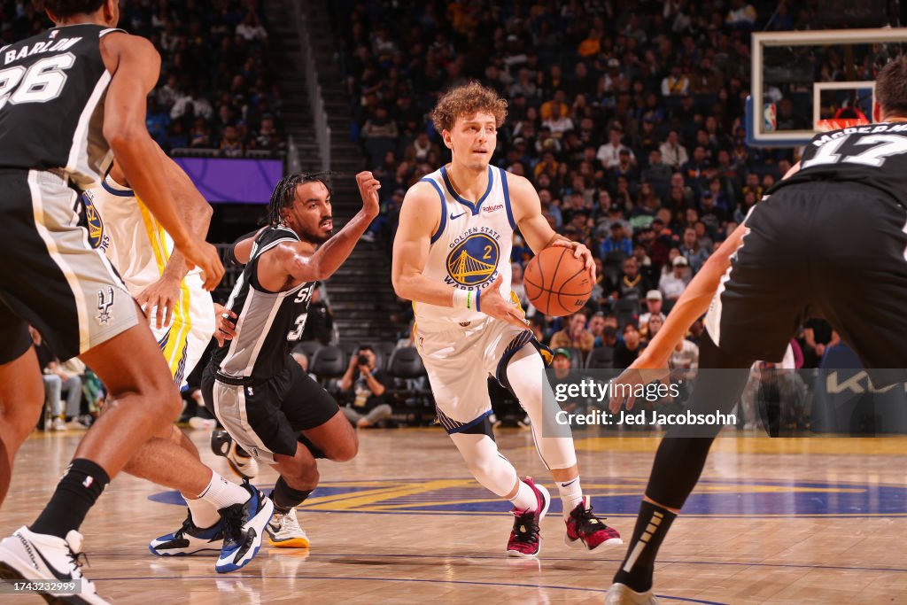 Brandin Podziemski of the Golden State Warriors drives to the basket ...