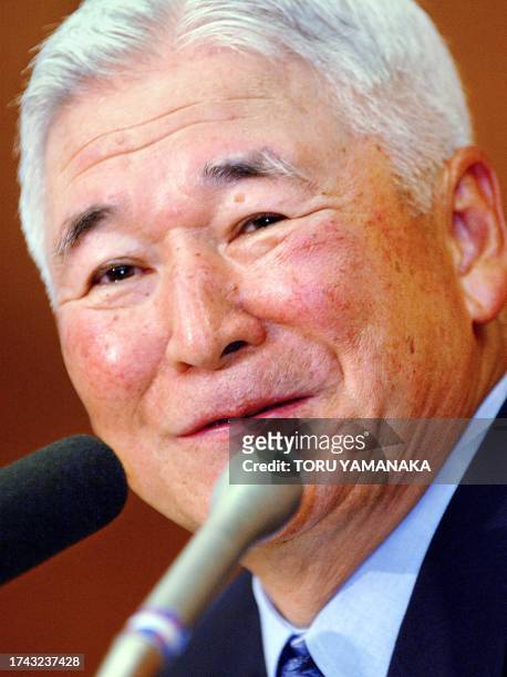 Bank of Japan governor Toshihiko Fukui smiles as he answers questions during a press conference at the headquarters in Tokyo, 17 July 2003. Both...