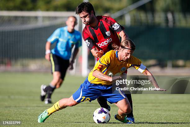 Claudio Yacob of West Bromwich Albion challenges Attila Polonkyi of Puskas FC Academy during the pre season friendly match between Puskas FC Academy...