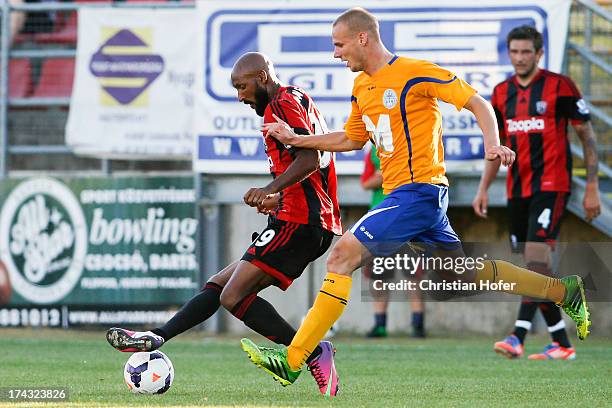 Nicolas Anelka of West Bromwich Albion challenges Gergoe Vaszicsky of Puskas FC Academy during the pre season friendly match between Puskas FC...