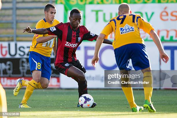 Saido Beramino of West Bromwich Albion challenges Rolawy Baracskai and Gergoe Vaszicsky of Puskas FC Academy during the pre season friendly match...