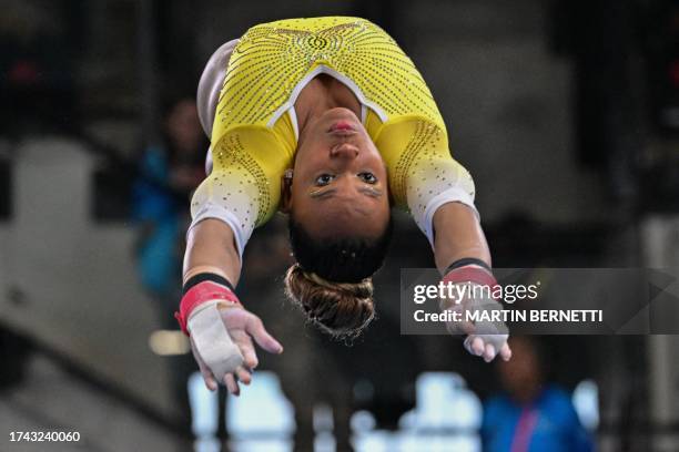 Brazil's Rebeca Andrade performs her routine to win the silver medal in the artistic gymnastics women's uneven bars final during the Pan American...