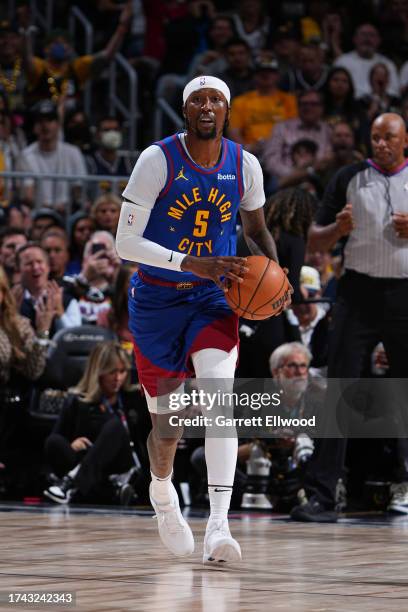 Kentavious Caldwell-Pope of the Denver Nuggets dribbles the ball during the game against the Los Angeles Lakers on October 24, 2023 at the Ball Arena...