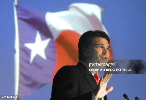 Texas Governor Rick Perry is seen speaking to an audience reagarding the Panamerican games in Mexico City 24 August 2002. El gobernador de Texas,...