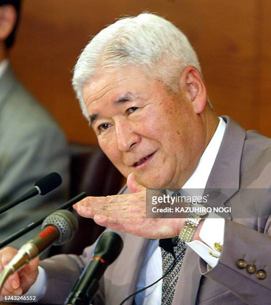 Bank of Japan Governor Toshihiko Fukui gestures as he speaks at a news conference in Tokyo, 11 June 2003. BOJ decided to leave its monetary policy...