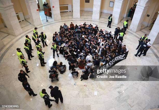 Capitol Police officers respond as protesters hold a demonstration in support of a cease-fire against the Palestinians in Gaza in the Cannon House...