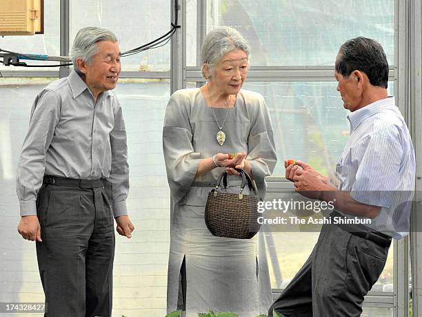 Emperor Akihito and Empress Michiko crop strawberry during their visit to a farmer on July 24, 2013 in Nasushiobara, Tochigi, Japan. The Emperor and...