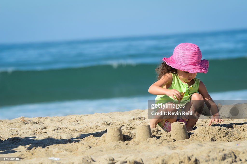 Child building sandcastle