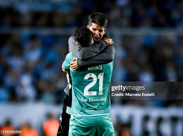 Sebastian Grazzini coach of Racing Club celebrates with his player Gabriel Arias after winning a match between Racing Club and Boca Juniors as part...