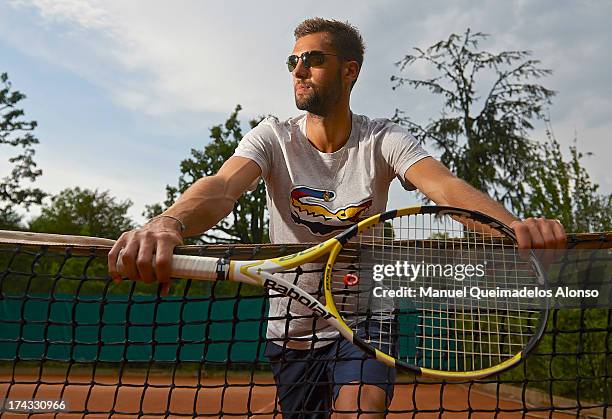 Professional tennis player Benoit Paire poses during a Maui Jim shoot at Lagardere Racing Club on July 23, 2013 in Paris, France.