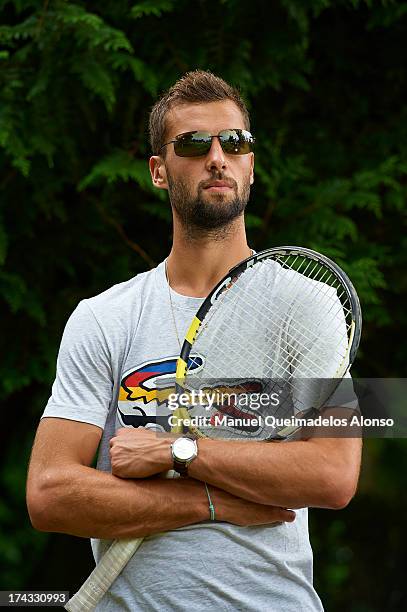 Professional tennis player Benoit Paire poses during a Maui Jim shoot at Lagardere Racing Club on July 23, 2013 in Paris, France.