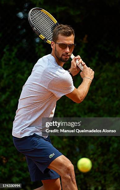 Professional tennis player Benoit Paire poses during a Maui Jim shoot at Lagardere Racing Club on July 23, 2013 in Paris, France.