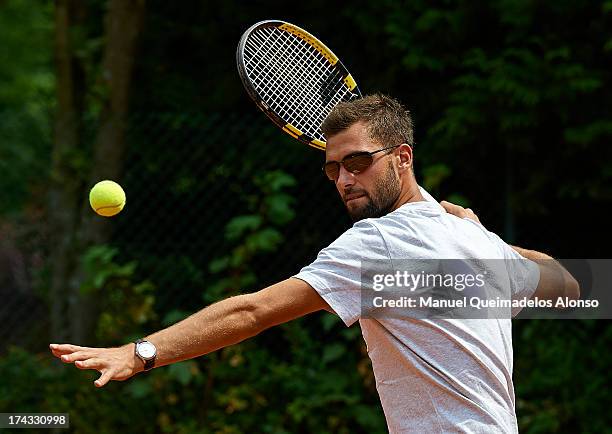 Professional tennis player Benoit Paire poses during a Maui Jim shoot at Lagardere Racing Club on July 23, 2013 in Paris, France.