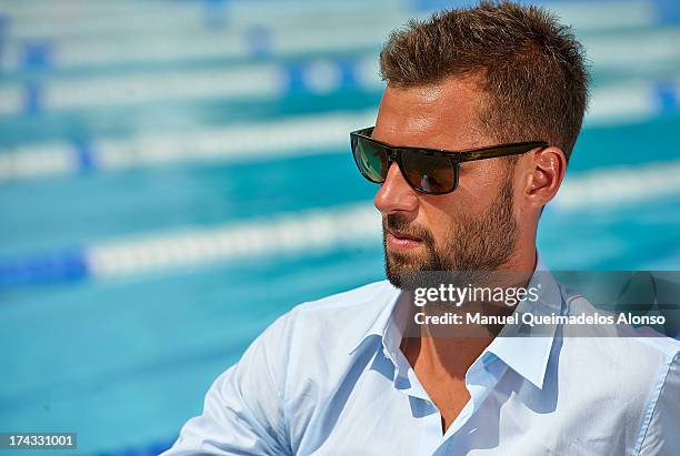 Professional tennis player Benoit Paire poses during a Maui Jim shoot at Lagardere Racing Club on July 23, 2013 in Paris, France.